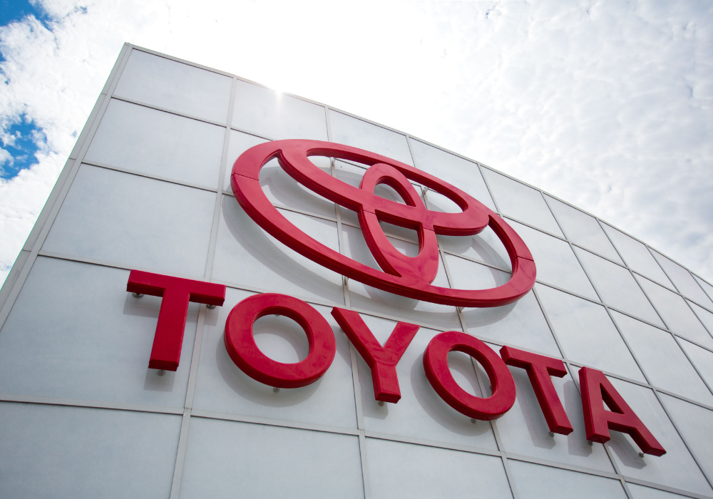Close up on the Toyota signage attached to the front of the Flow Toyota of Statesville dealership