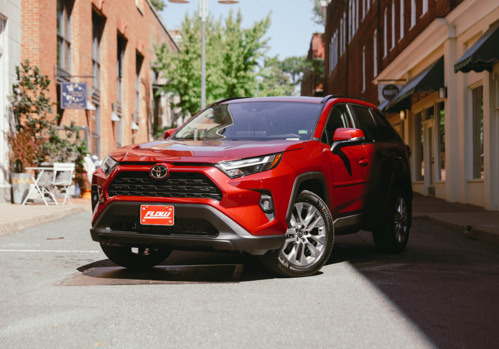 Red Toyota Rav4 parked in an alleyway