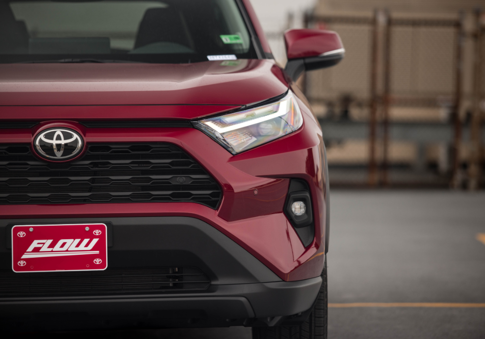 Close up photo of the front of a red Toyota RAV4